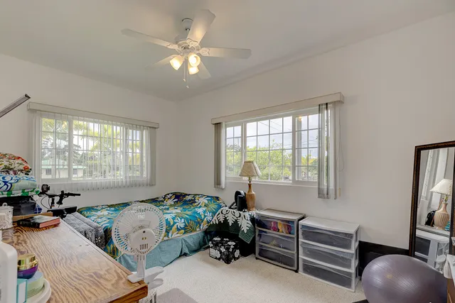 a bedroom with furniture and a window