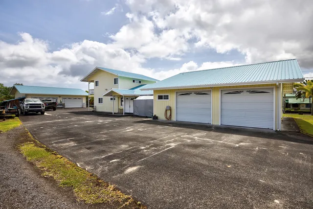 a view of a car park in front of house