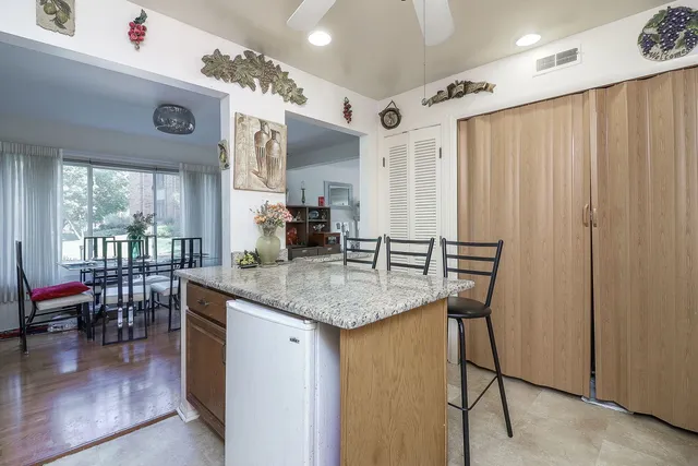 a kitchen with stainless steel appliances granite countertop a sink and cabinets