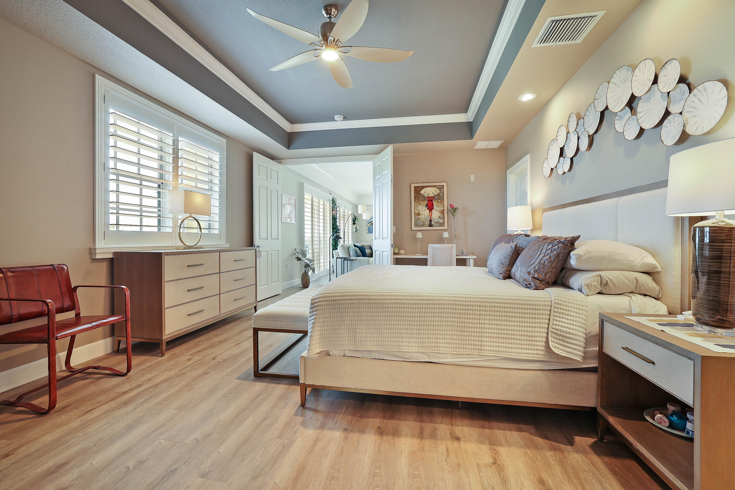 810 Juno Ocean Walk, Unit 401B Juno Beach, FL 33408 - Photo 13 of 57 a bedroom with a bed and wooden floor