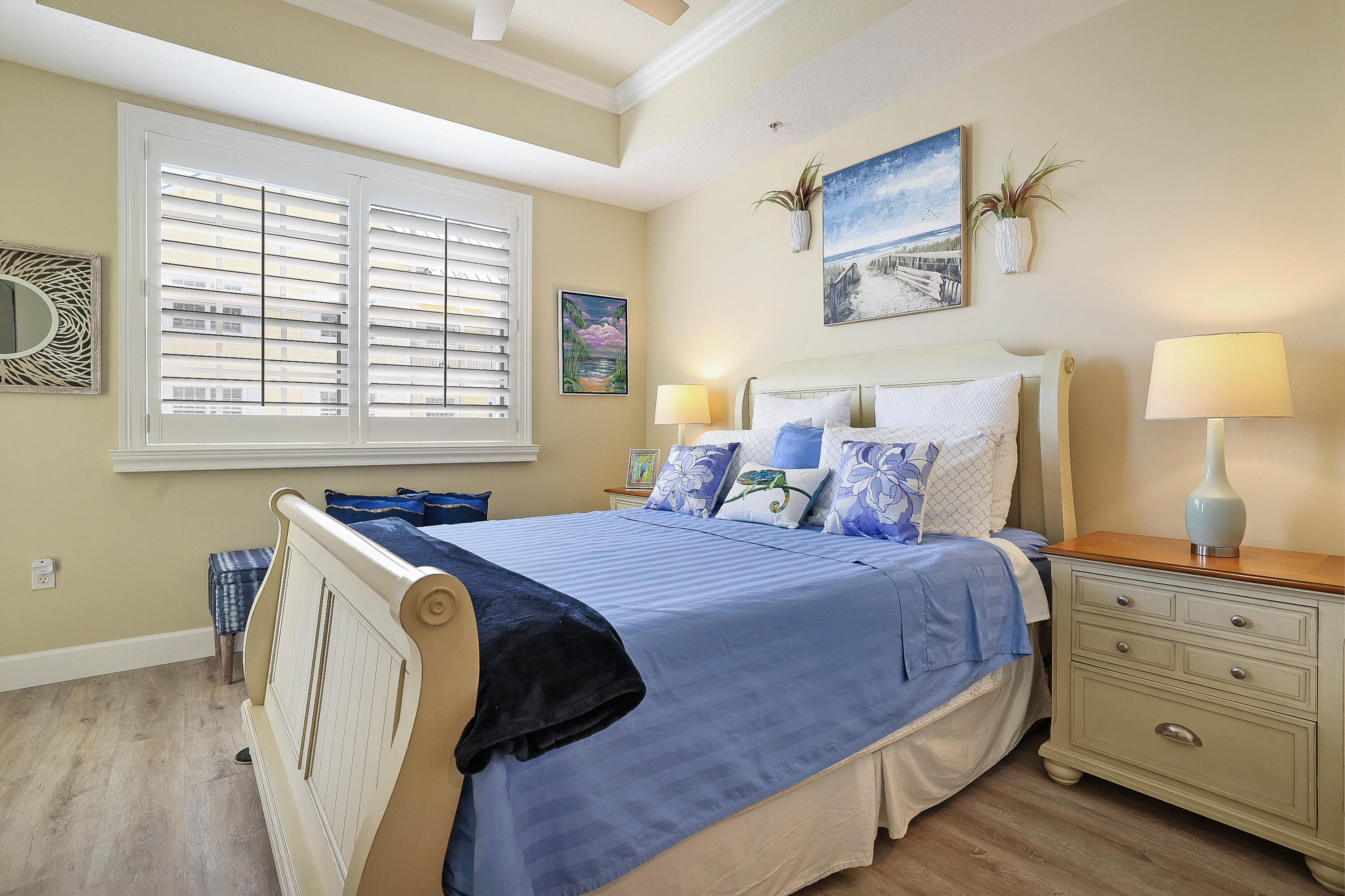 810 Juno Ocean Walk, Unit 401B Juno Beach, FL 33408 - Photo 17 of 57 a bedroom with a bed and a window