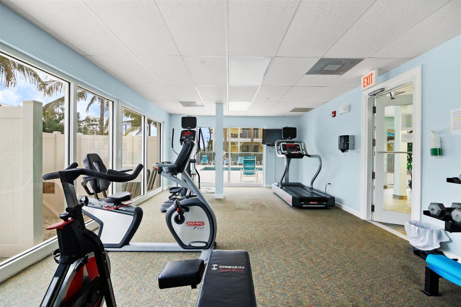 810 Juno Ocean Walk, Unit 401B Juno Beach, FL 33408 - Photo 20 of 57 a view of a room with gym equipment