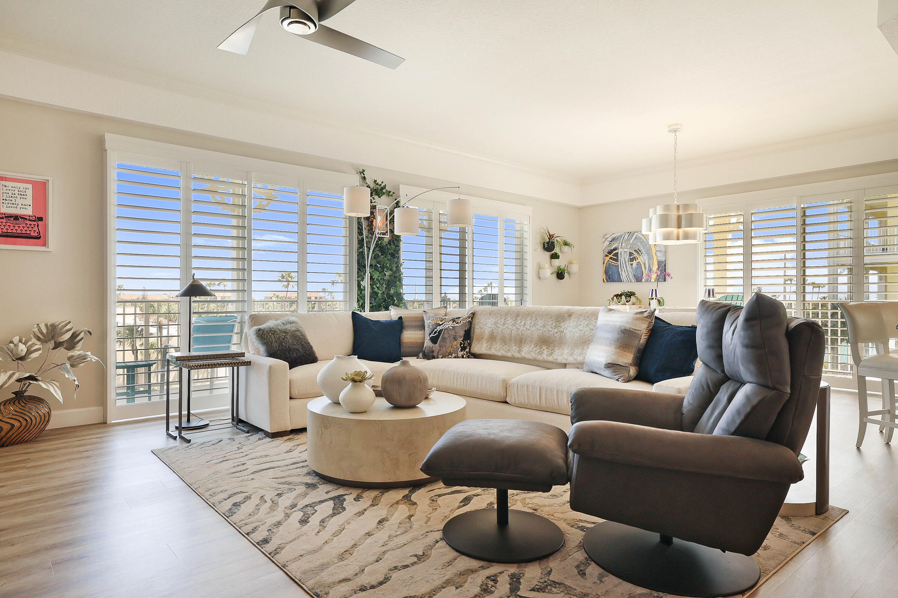 810 Juno Ocean Walk, Unit 401B Juno Beach, FL 33408 - Photo 26 of 57 a living room with furniture and a large window
