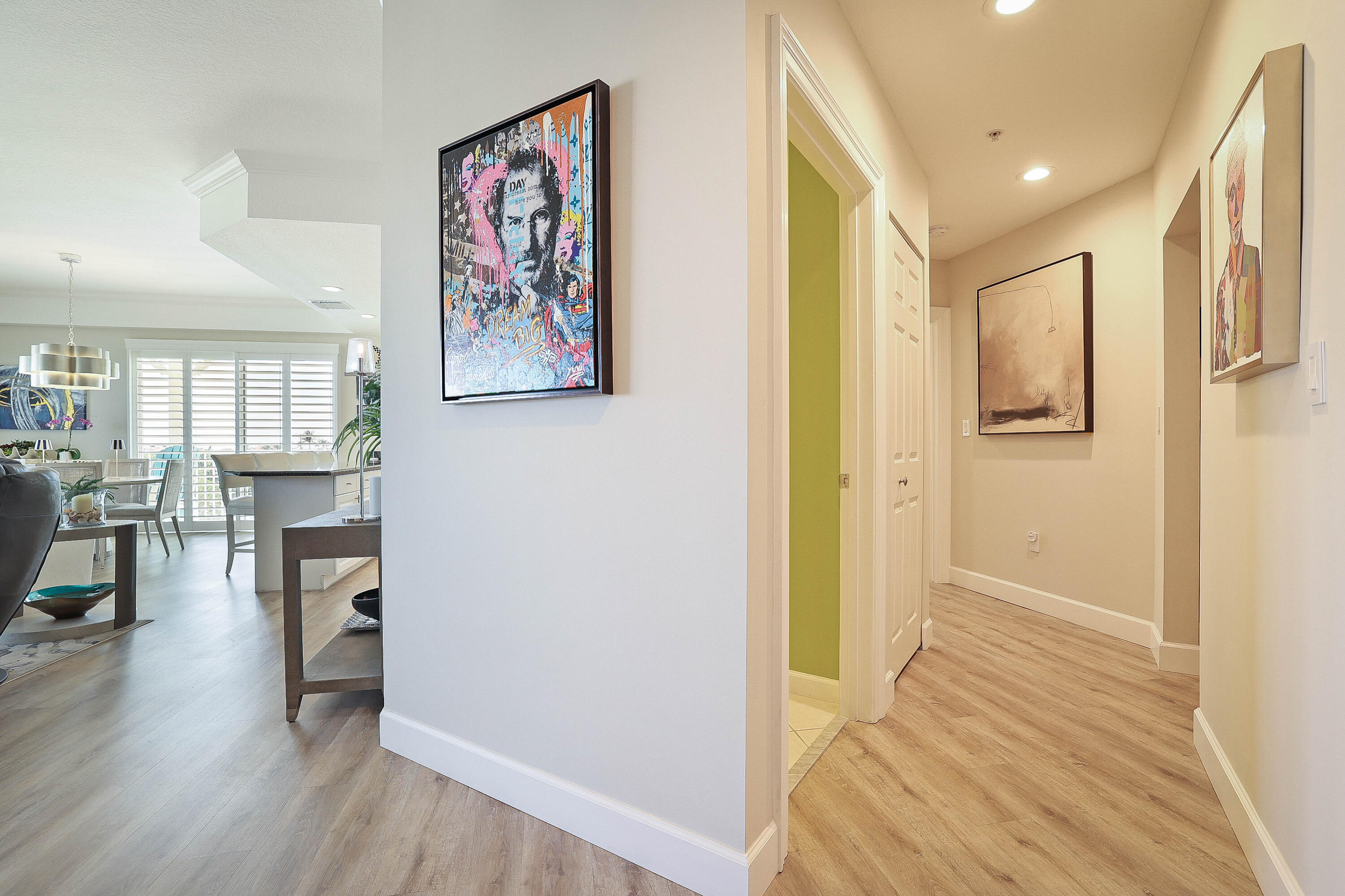 810 Juno Ocean Walk, Unit 401B Juno Beach, FL 33408 - Photo 38 of 57 a view of a hallway with wooden floor and dining room