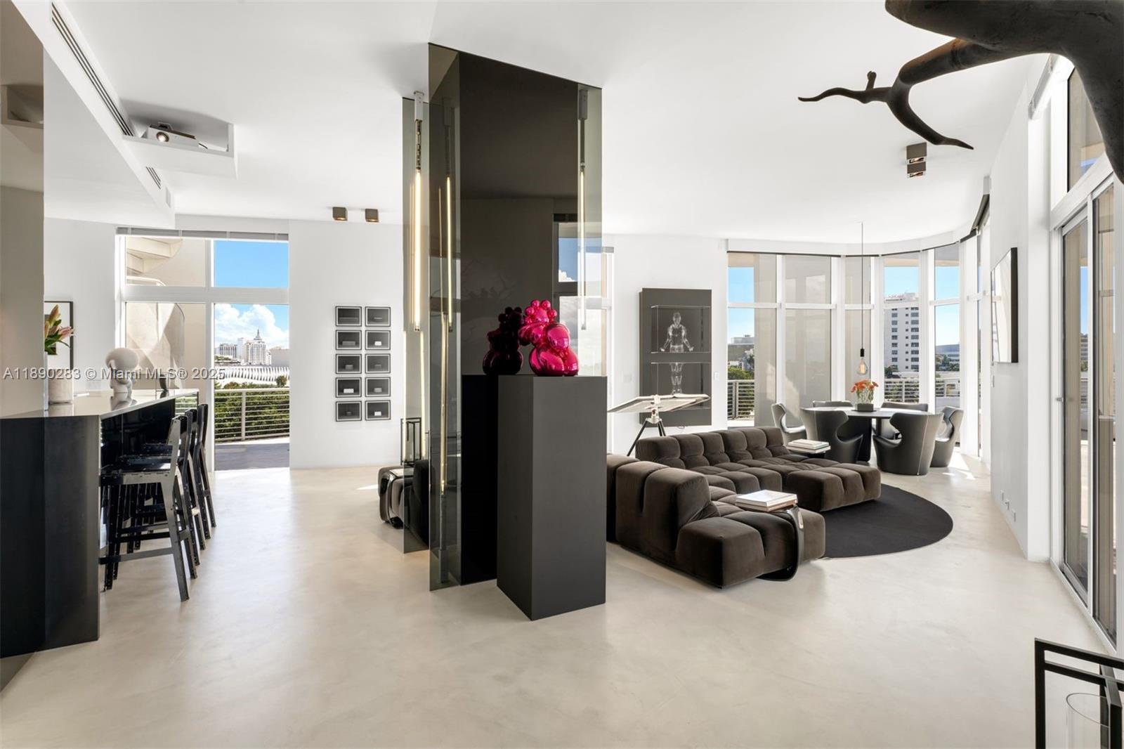 2001 Meridian Avenue, Unit PH01 Miami Beach, FL 33139 - Photo 15 of 63 a living room with furniture and a fireplace