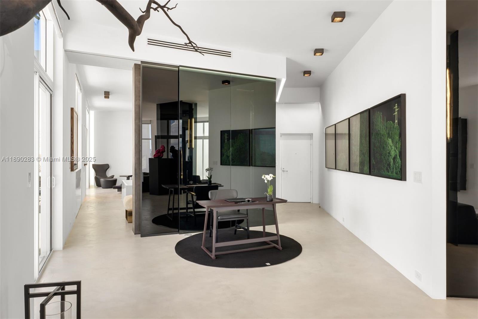 2001 Meridian Avenue, Unit PH01 Miami Beach, FL 33139 - Photo 17 of 63 a living room with furniture and a flat screen tv