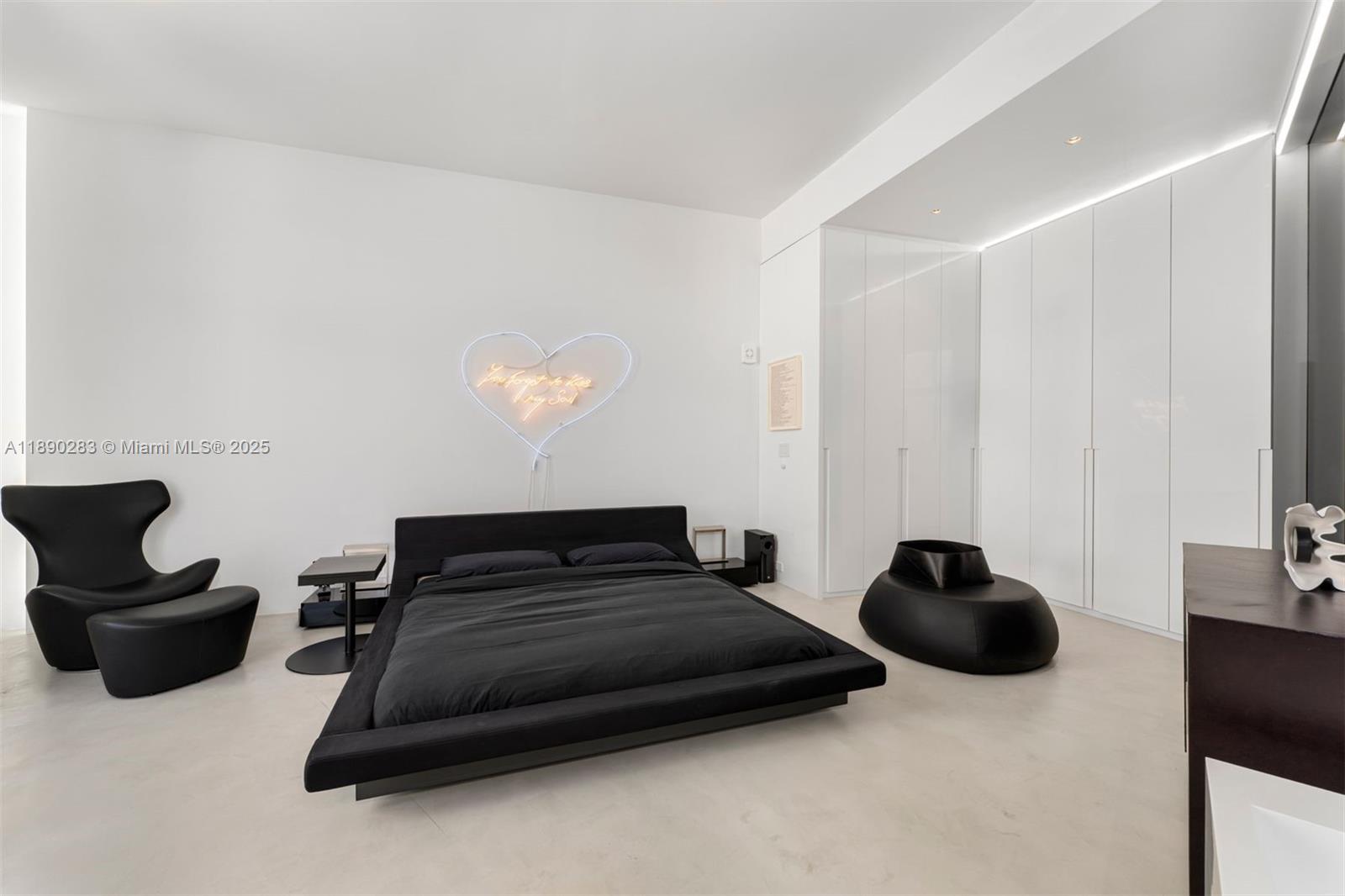 2001 Meridian Avenue, Unit PH01 Miami Beach, FL 33139 - Photo 20 of 63 a bedroom with a bed and a chair