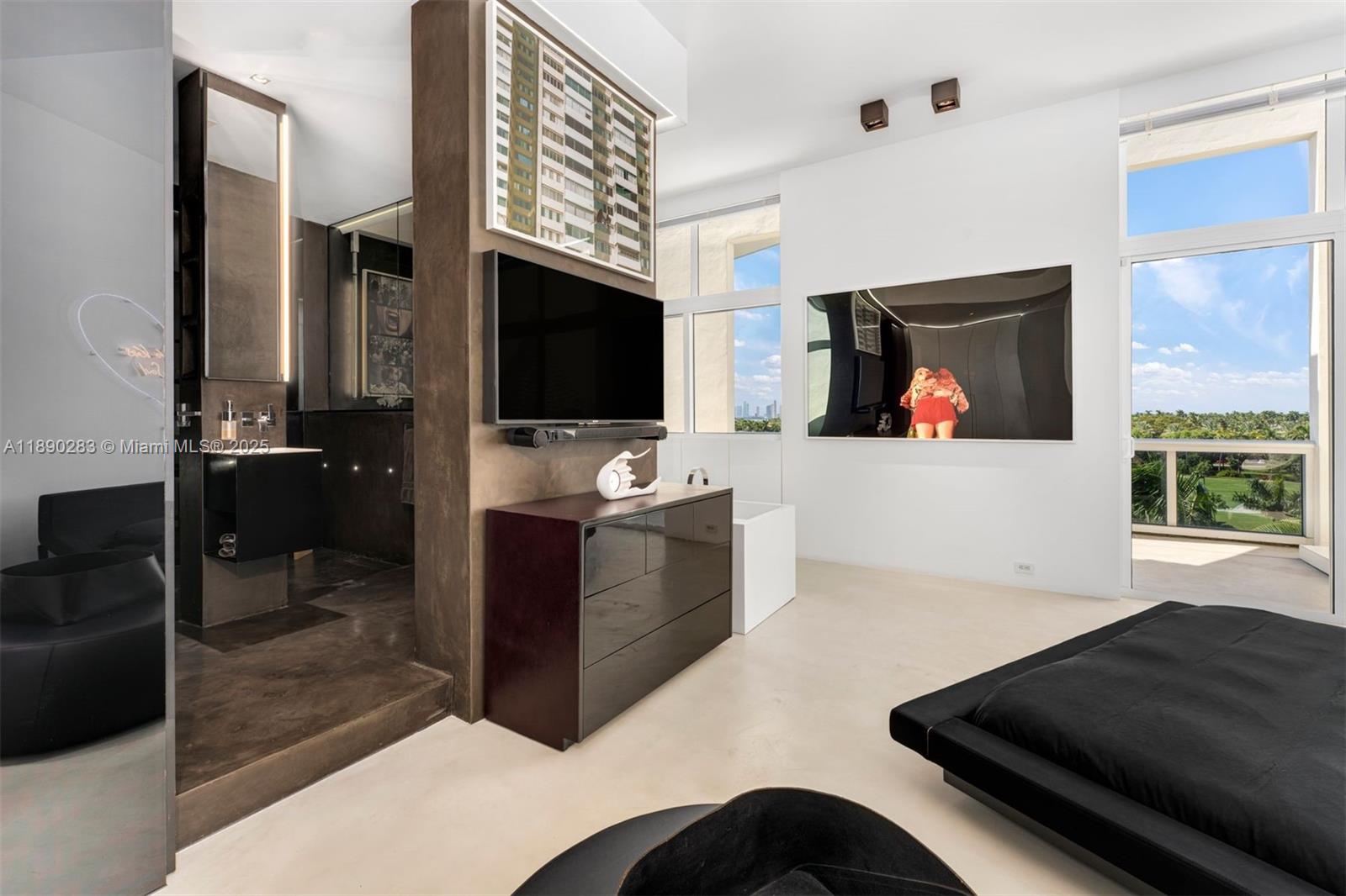 2001 Meridian Avenue, Unit PH01 Miami Beach, FL 33139 - Photo 22 of 63 a living room with furniture and a flat screen tv