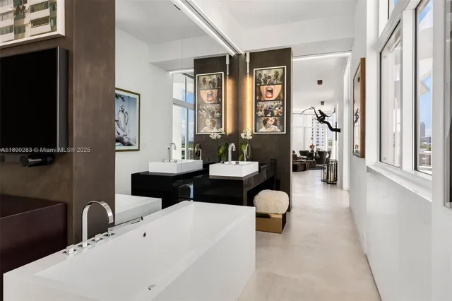 a room with furniture and a floor to ceiling window