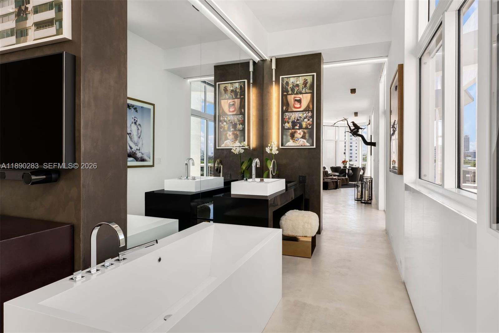 2001 Meridian Avenue, Unit PH01 Miami Beach, FL 33139 - Photo 27 of 63 a living room with furniture and a large window