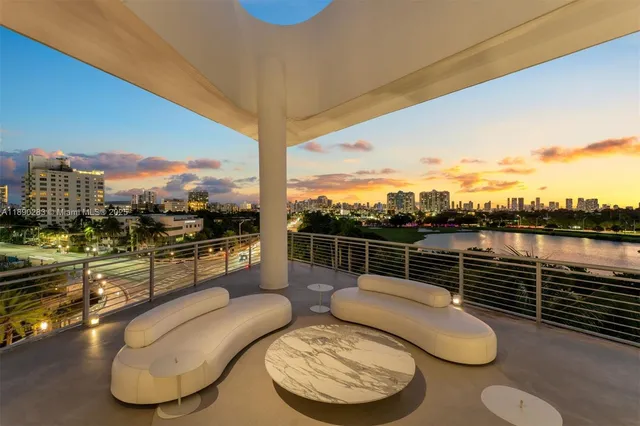 a view of a balcony with furniture