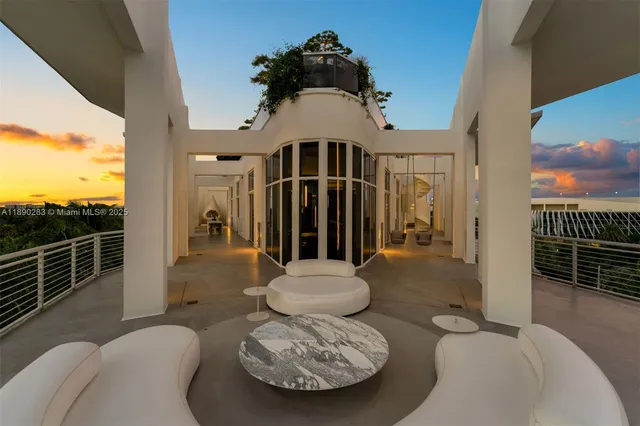 a view of a swimming pool with an outdoor seating and a yard