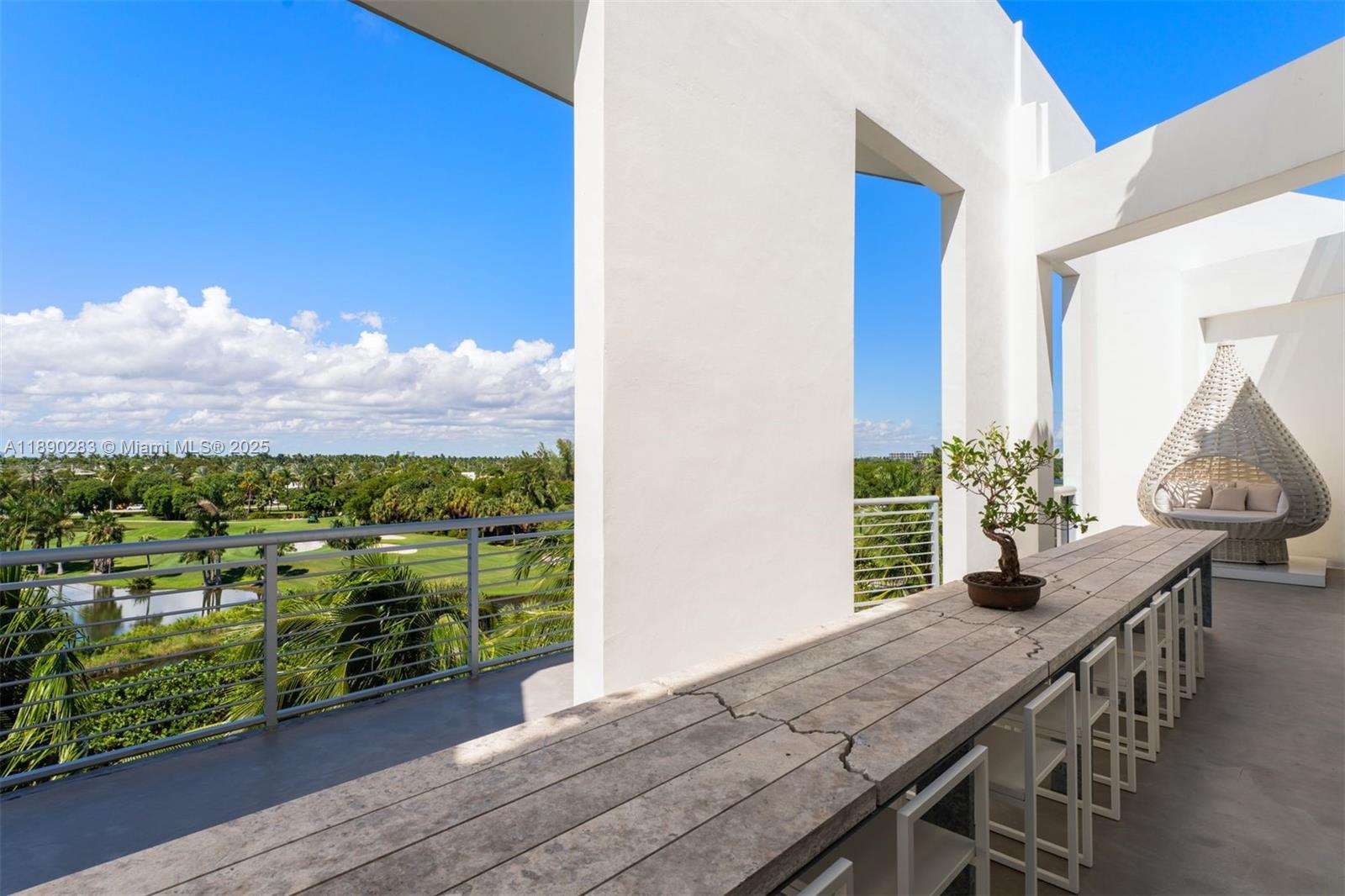 2001 Meridian Avenue, Unit PH01 Miami Beach, FL 33139 - Photo 36 of 63 a view of a balcony with table and chairs