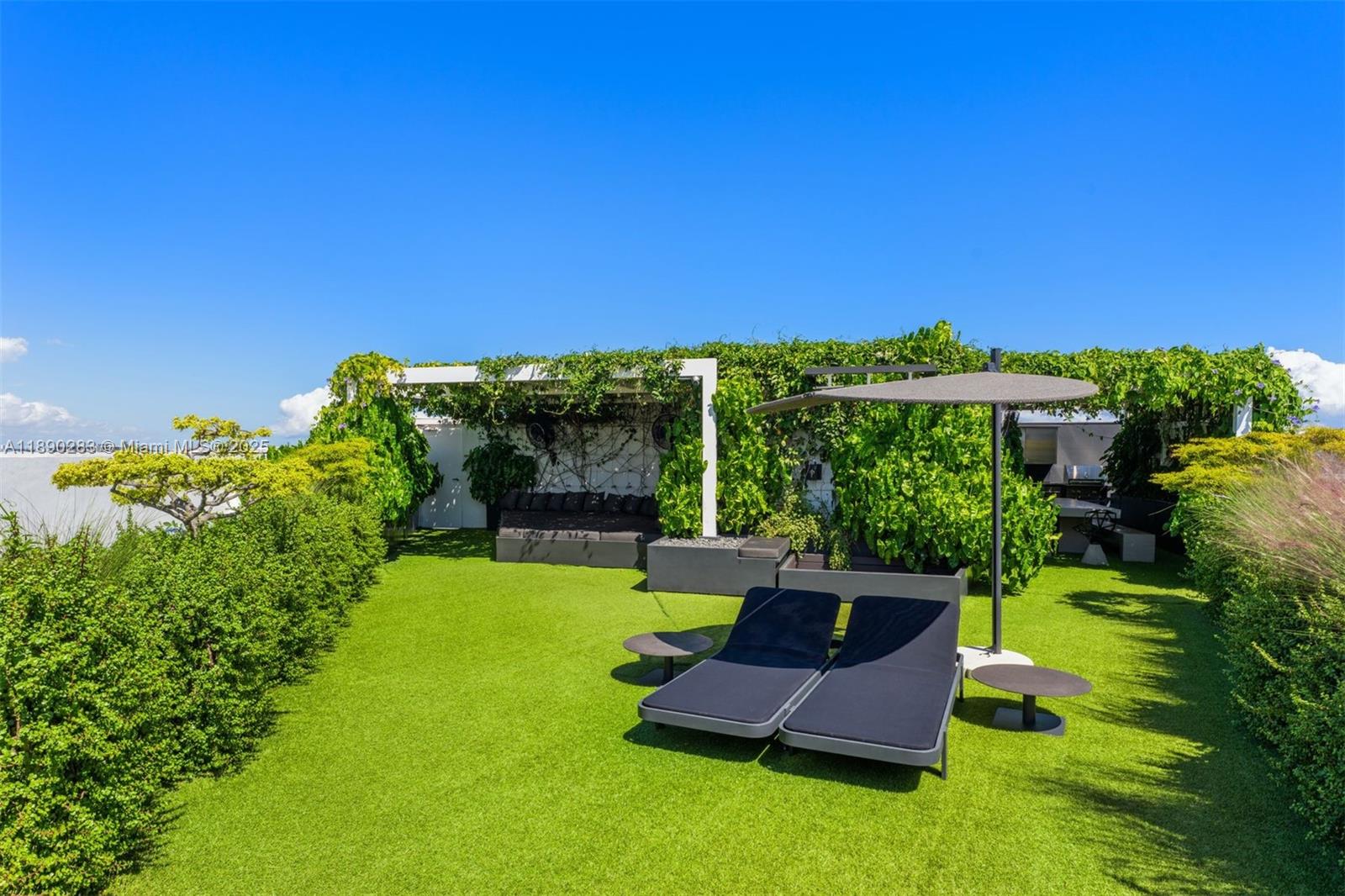 2001 Meridian Avenue, Unit PH01 Miami Beach, FL 33139 - Photo 47 of 63 a view of a garden with a patio