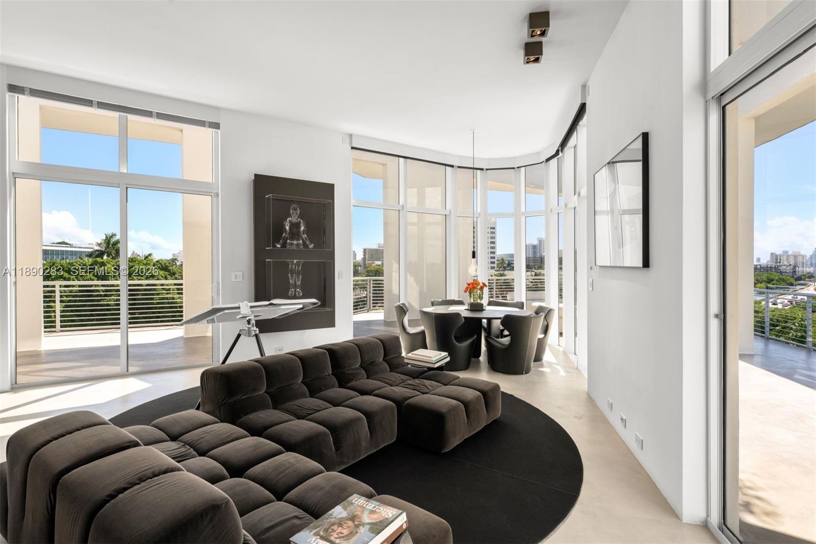 2001 Meridian Avenue, Unit PH01 Miami Beach, FL 33139 - Photo 6 of 63 a living room with furniture and a large window