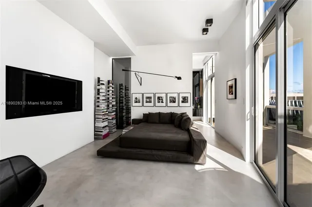 a living room with a couch and a flat screen tv