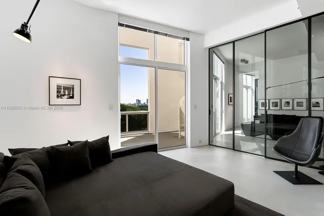 a living room with furniture fireplace and flat screen tv