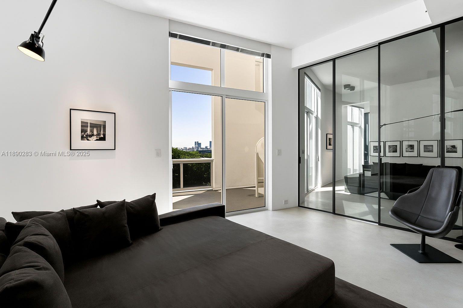 2001 Meridian Avenue, Unit PH01 Miami Beach, FL 33139 - Photo 8 of 63 a living room with furniture fireplace and flat screen tv