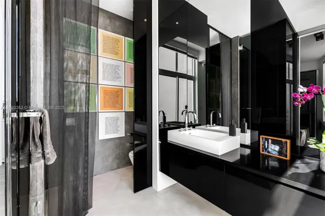 a bathroom with a double vanity sink and a mirror