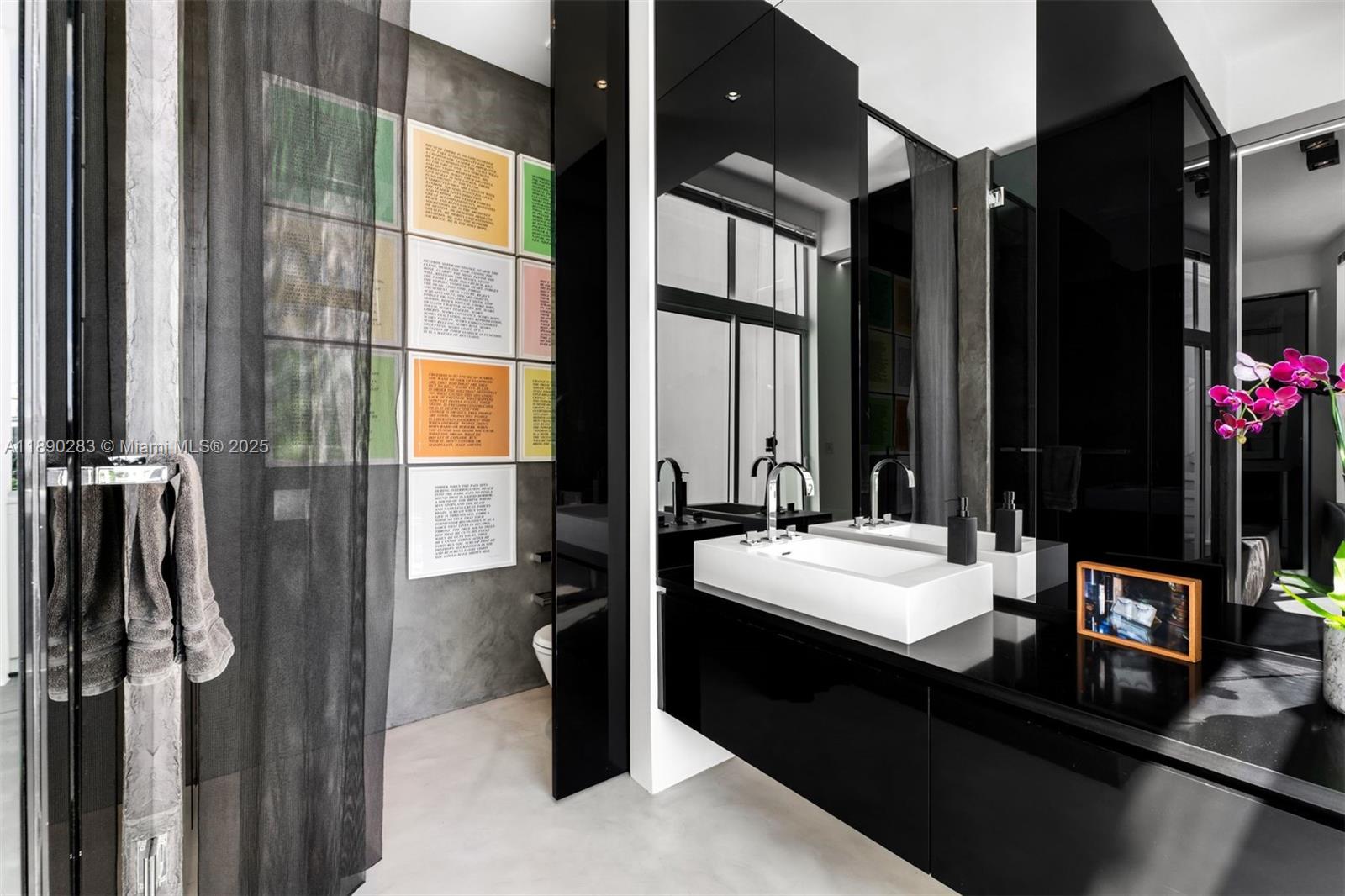 2001 Meridian Avenue, Unit PH01 Miami Beach, FL 33139 - Photo 9 of 63 a bathroom with a double vanity sink and a mirror