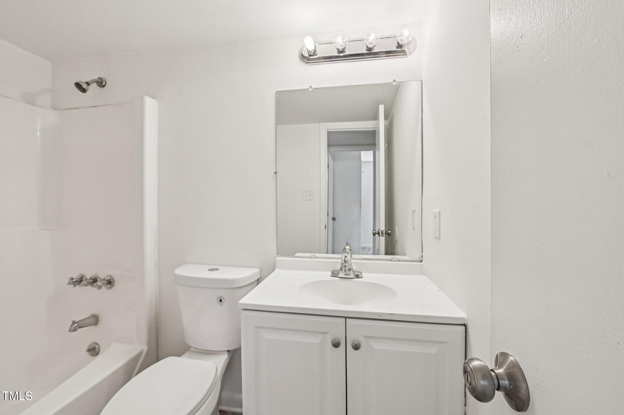 642 Pine Ridge Place Raleigh, NC 27609 - Photo 13 of 15 a bathroom with a sink a toilet and shower