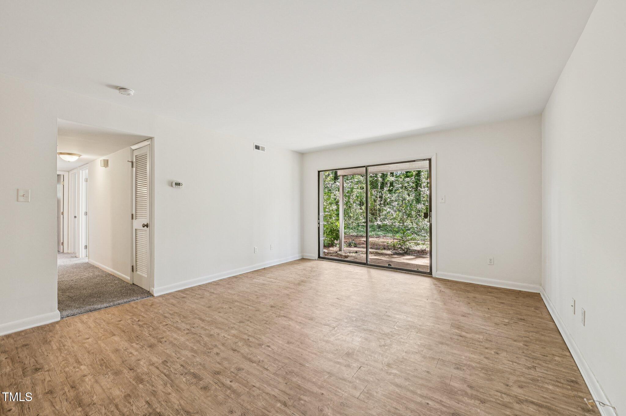 642 Pine Ridge Place Raleigh, NC 27609 - Photo 3 of 15 a view of an empty room with a window