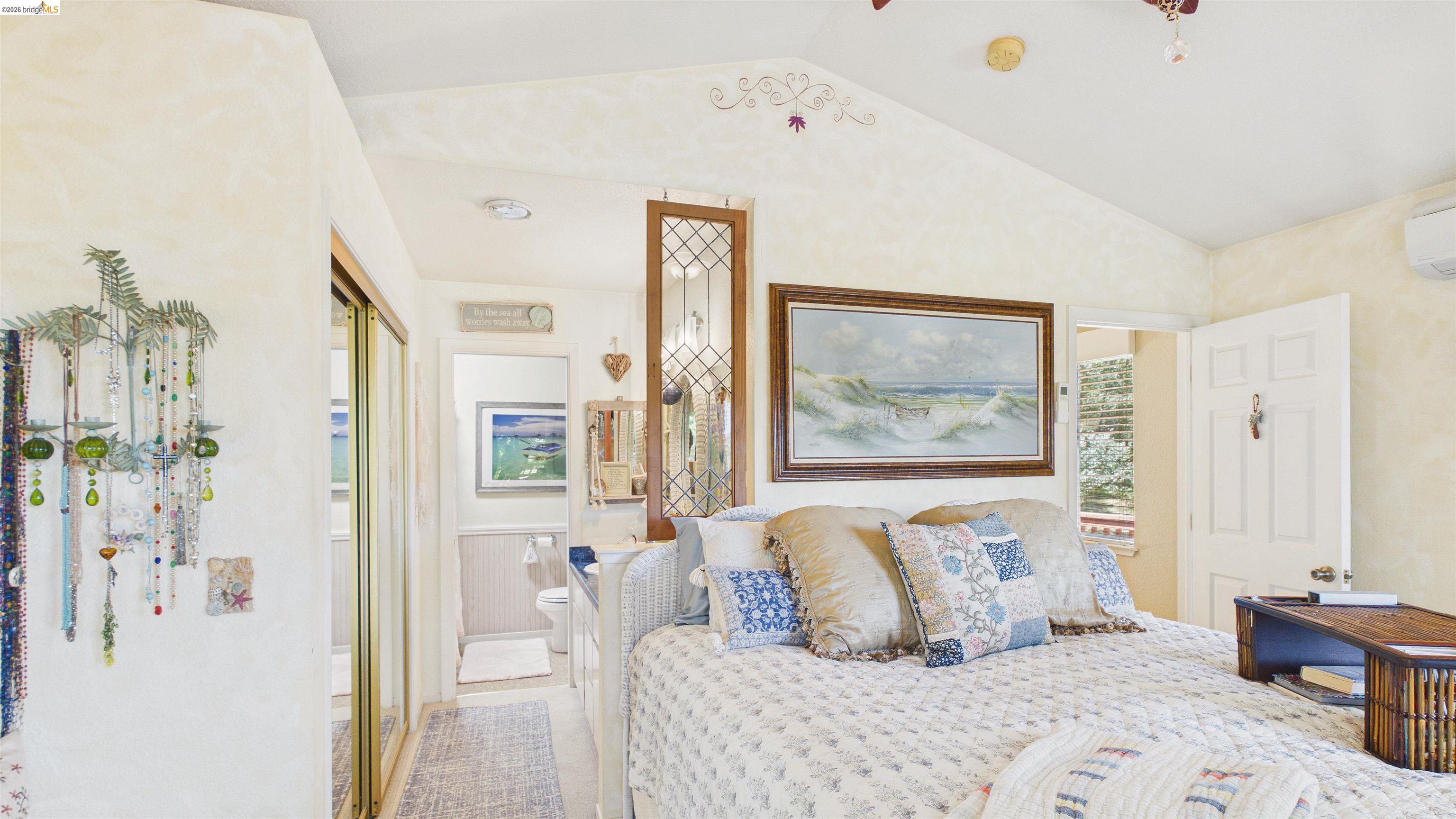 18102 Mt Eaton Road Tuolumne, CA 95379 - Photo 15 of 44 Bedroom featuring a vaulted ceiling and a split-system air conditioning unit