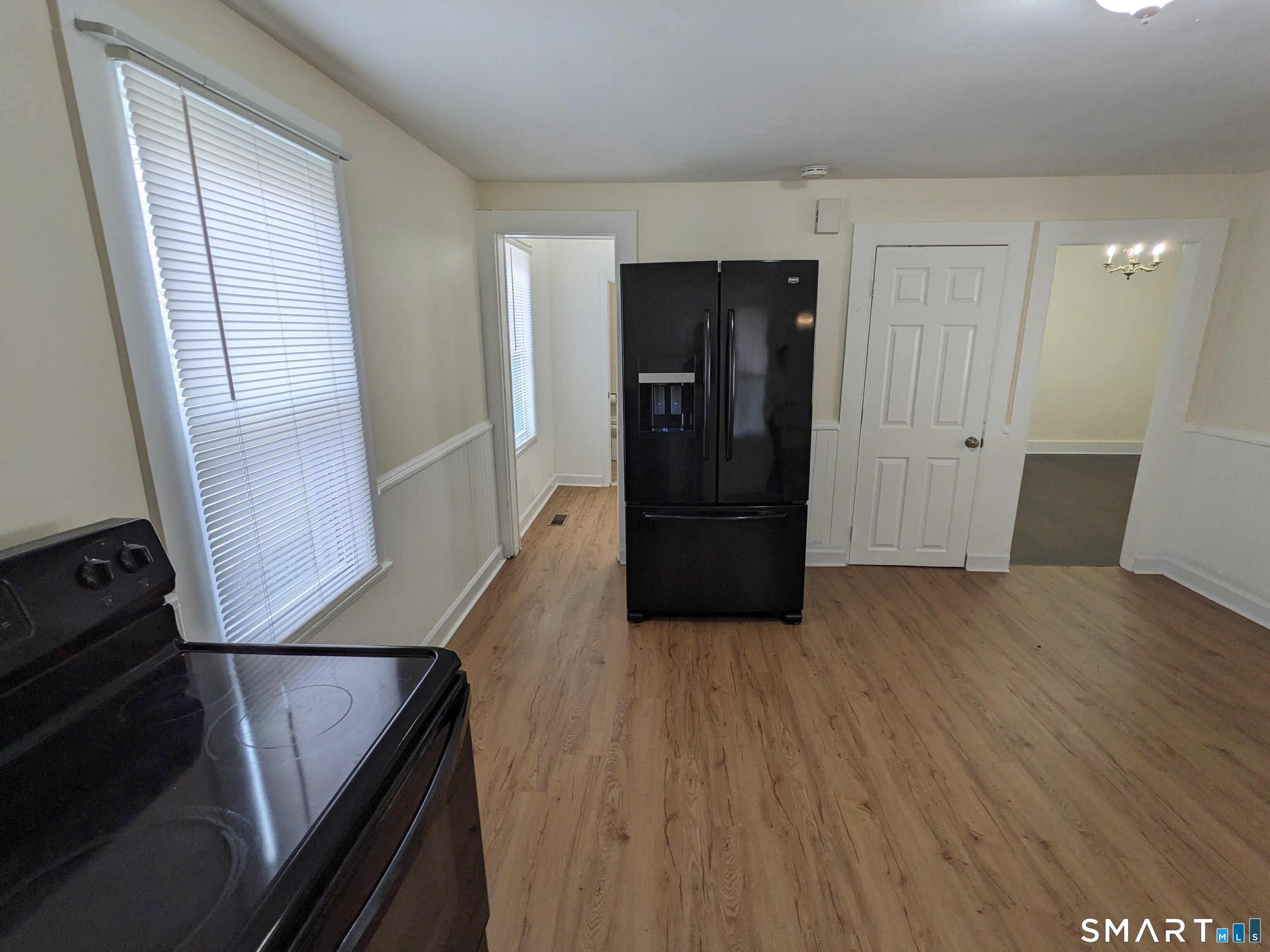 232 Hawkins Street Derby, CT 06418 - Photo 20 of 27 a view of hallway with wooden floor and stairs