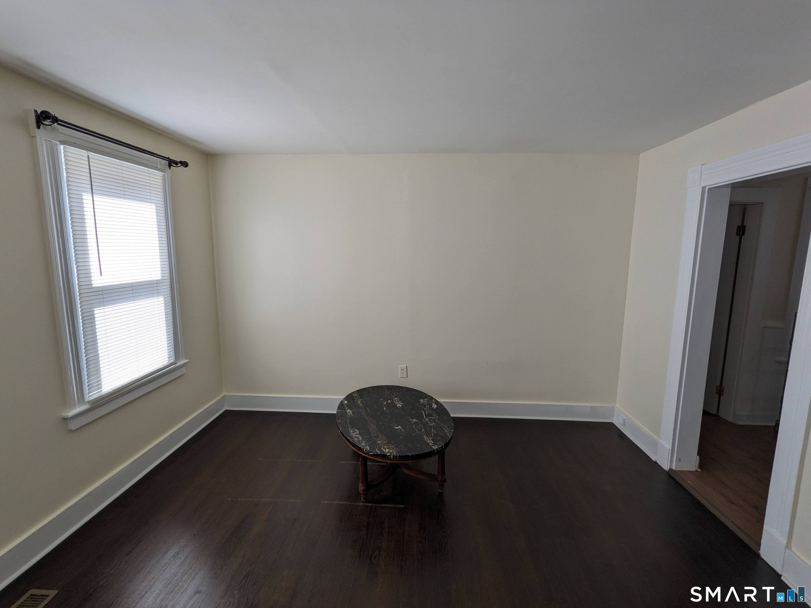232 Hawkins Street Derby, CT 06418 - Photo 25 of 27 a view of a small space with wooden floor and a window