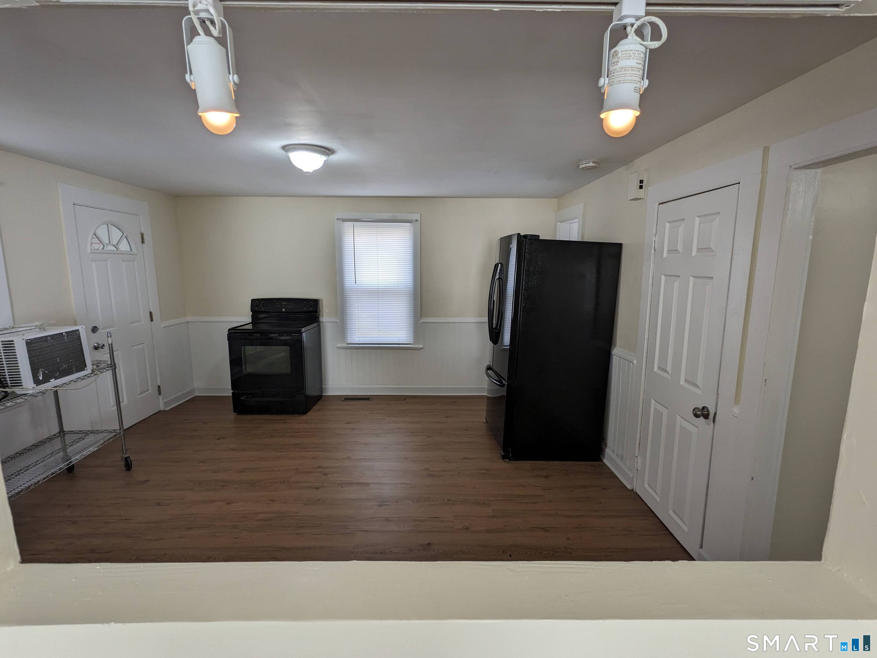232 Hawkins Street Derby, CT 06418 - Photo 26 of 27 a view of a livingroom with furniture and an empty space