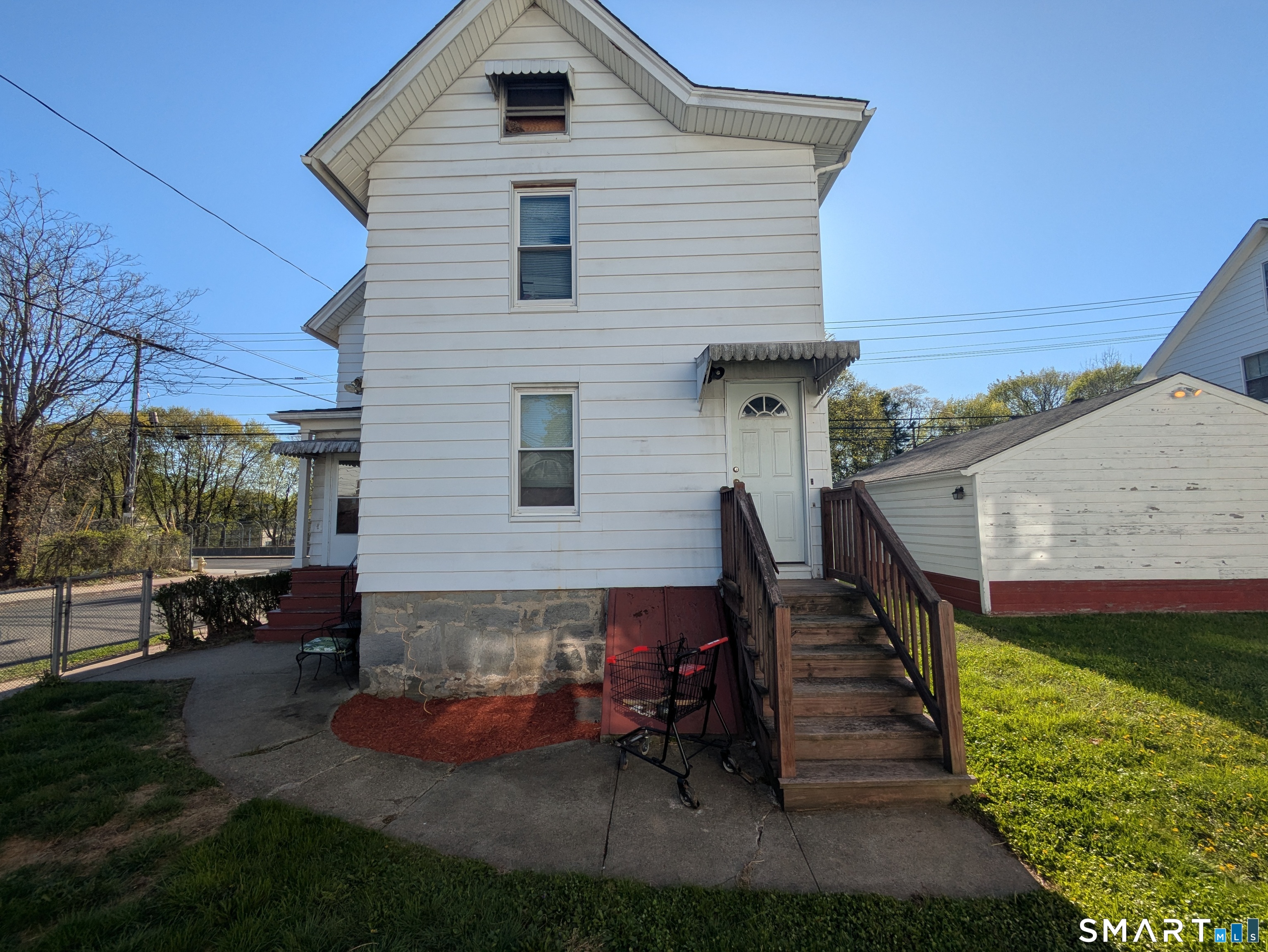 232 Hawkins Street Derby, CT 06418 - Photo 8 of 27 a wooden bench sitting in front of a house