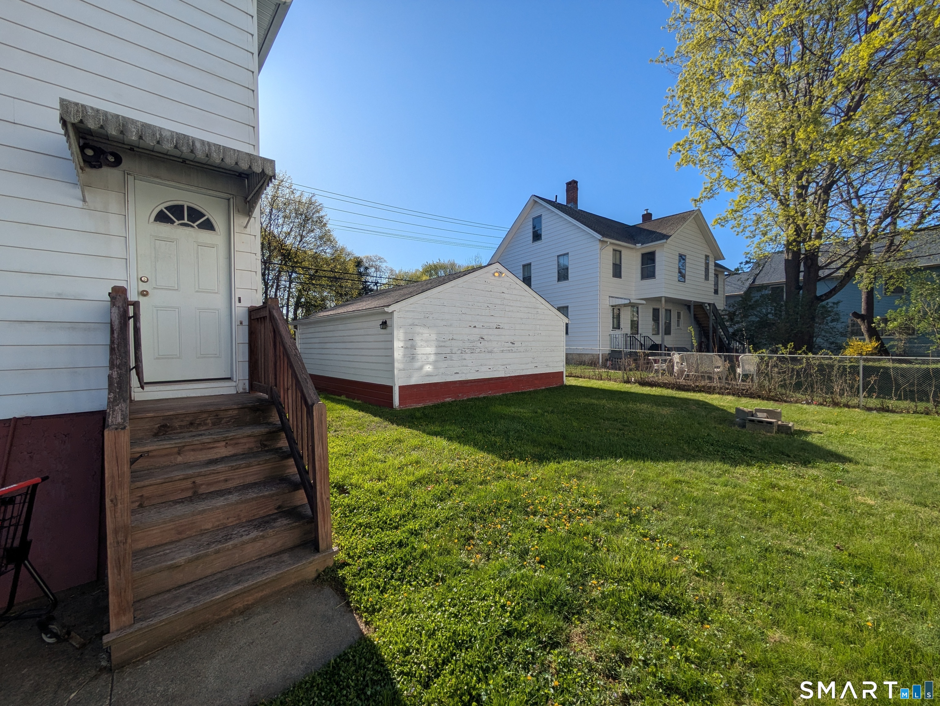 232 Hawkins Street Derby, CT 06418 - Photo 10 of 27 a view of a house with a yard balcony and a small pool
