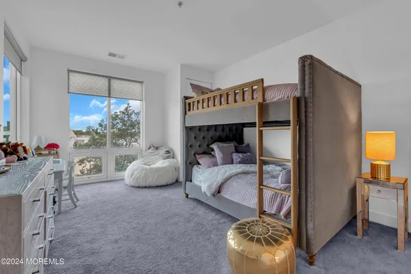 a bedroom with furniture and a fireplace