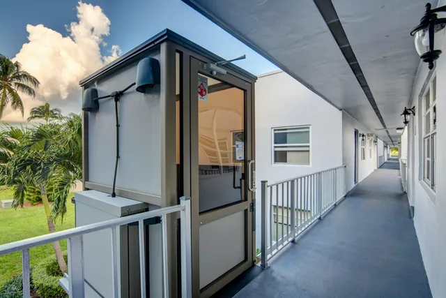 a view of a house with wooden deck