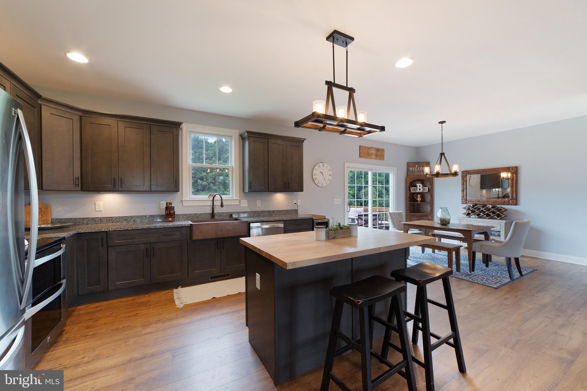 12204 Old Stillhouse Road Boston, VA 22713 - Photo 12 of 39 stainless, granite, farm sink and upgraded cabinet