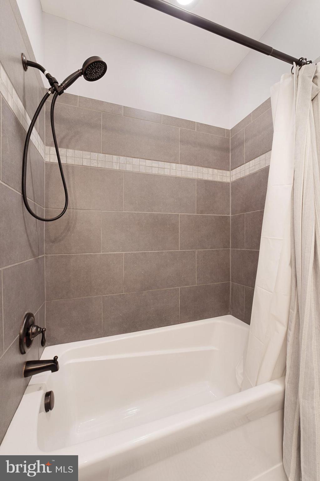 12204 Old Stillhouse Road Boston, VA 22713 - Photo 23 of 39 upgraded tub and ceramic surround