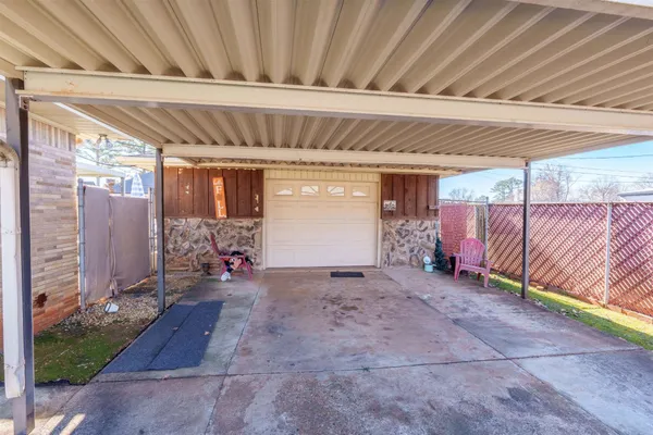 a view of backyard with patio
