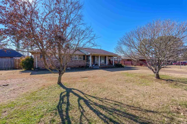 a view of house with outdoor space and sitting area