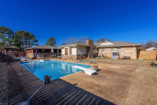 a front view of a house with swimming pool
