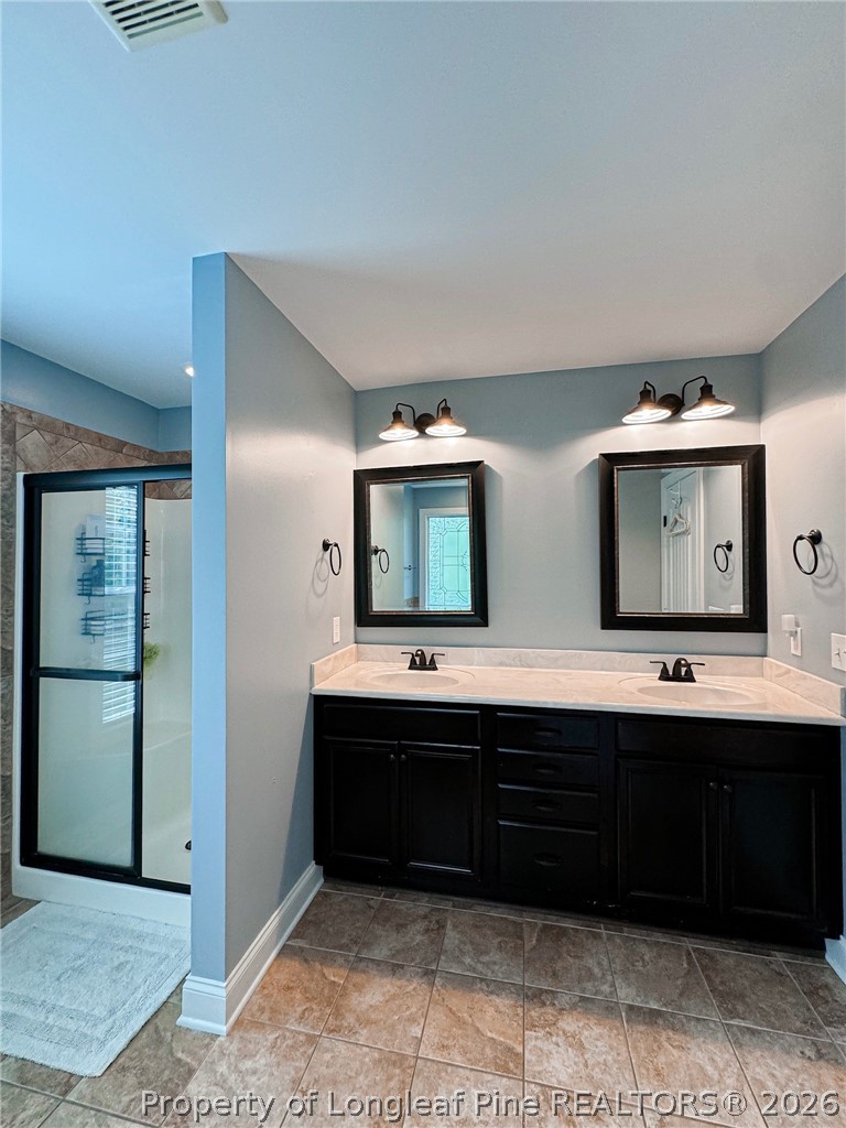 93 Falcon Ridge Drive Spring Lake, NC 28390 - Photo 31 of 50 a spacious bathroom with double vanity and a mirror