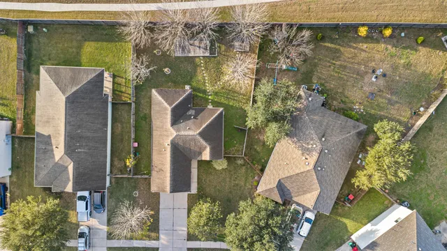 an aerial view of residential houses with outdoor space