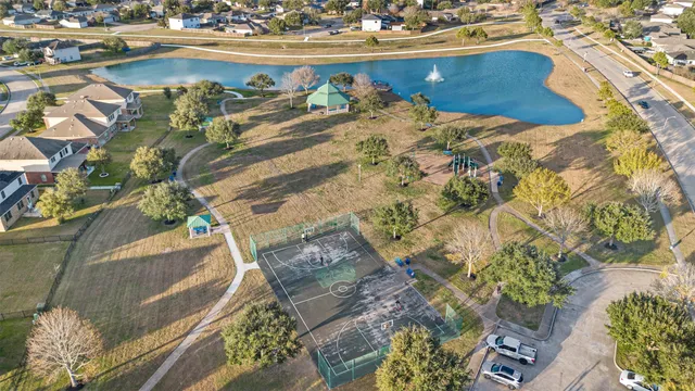 an aerial view of residential houses with city view
