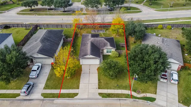 an aerial view of a house with a lake view