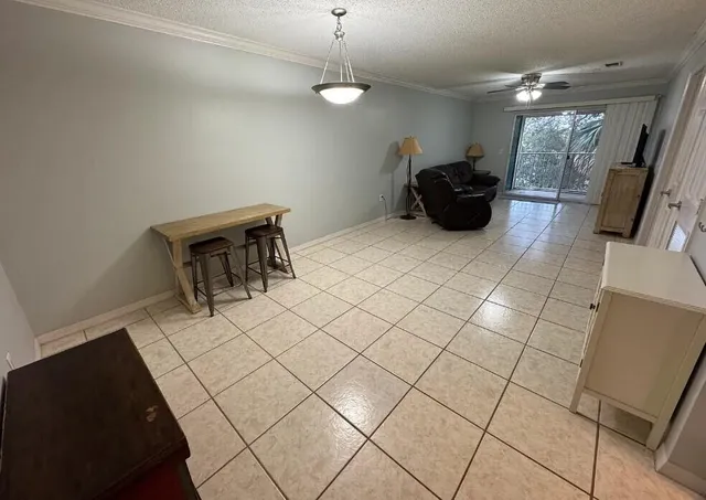 a spacious bathroom with a sink and a mirror