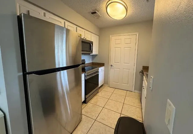 a kitchen with sink and window