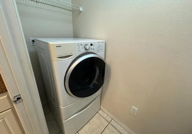 a bedroom with a bed dresser and a window