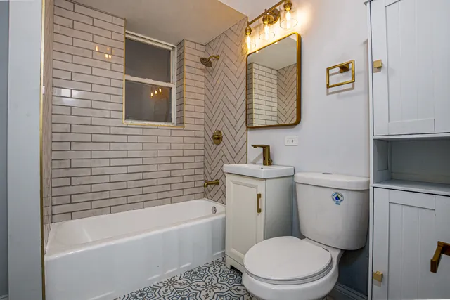 a kitchen with a sink cabinets and wooden floor