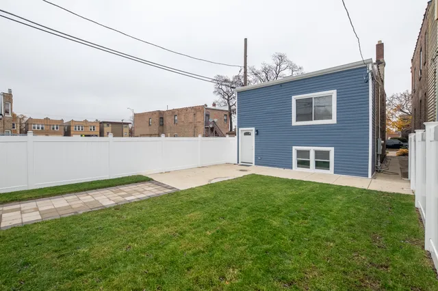 a backyard of a house with lots of green space