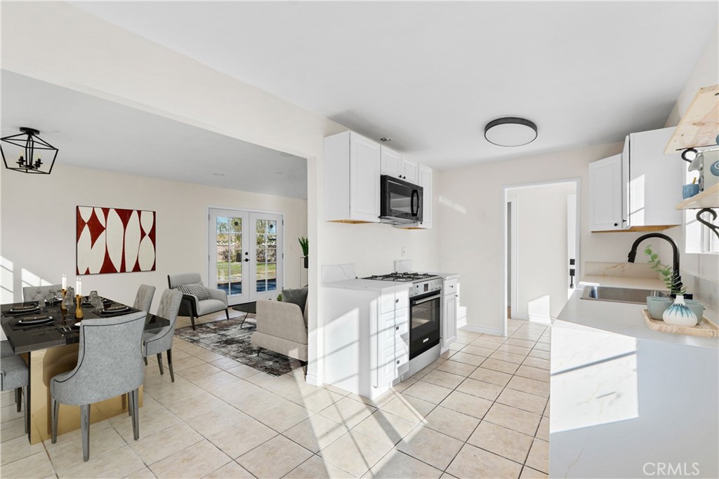 1347 East Ave R-3 Palmdale, CA 93550 - Photo 6 of 22 Kitchen with staged dinning room