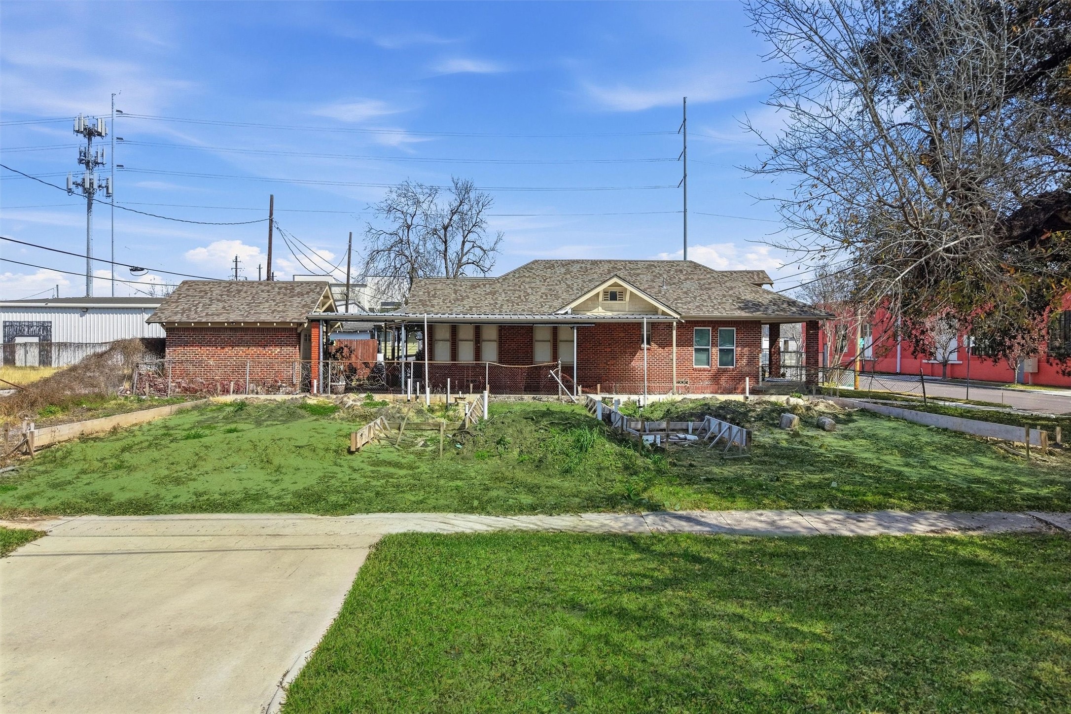 116 Everton Street Houston, TX 77003 - Photo 14 of 14 a front view of a house with a garden